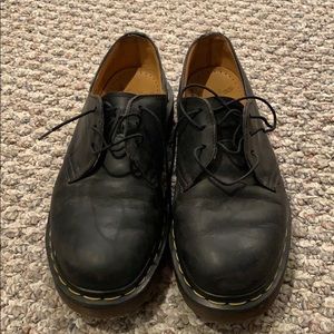 slightly worn black doc martens